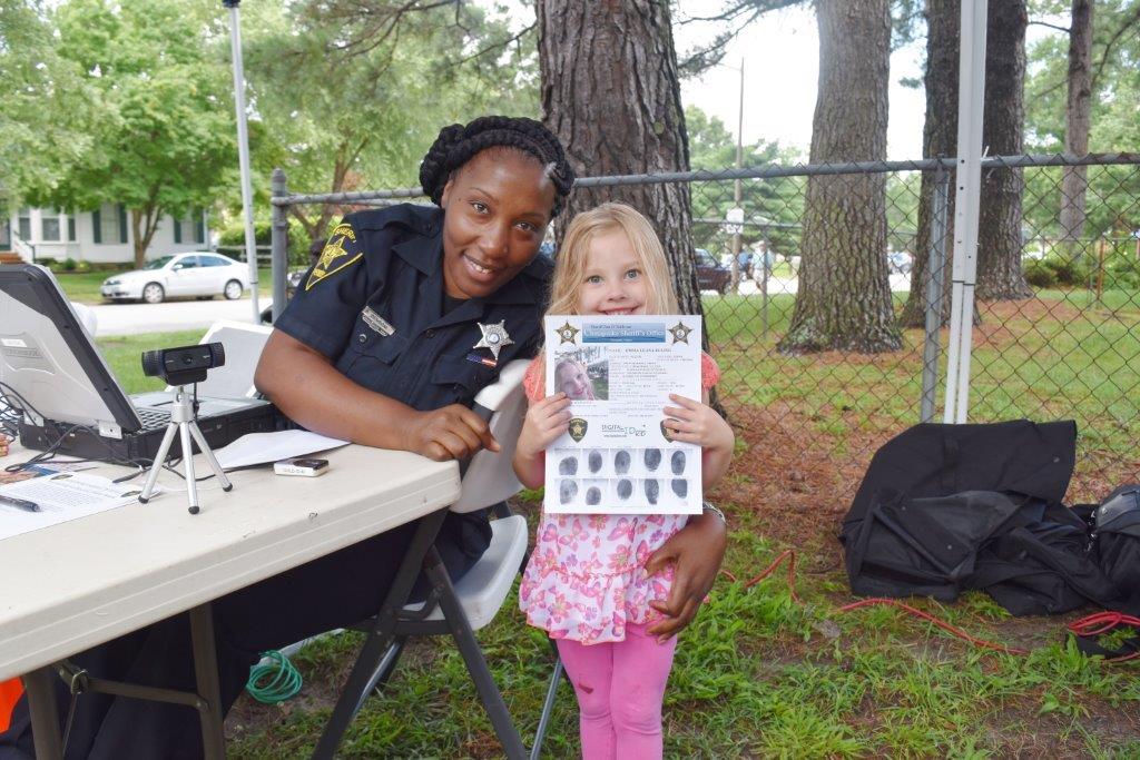 Deputy posing with finished product of Digital ID